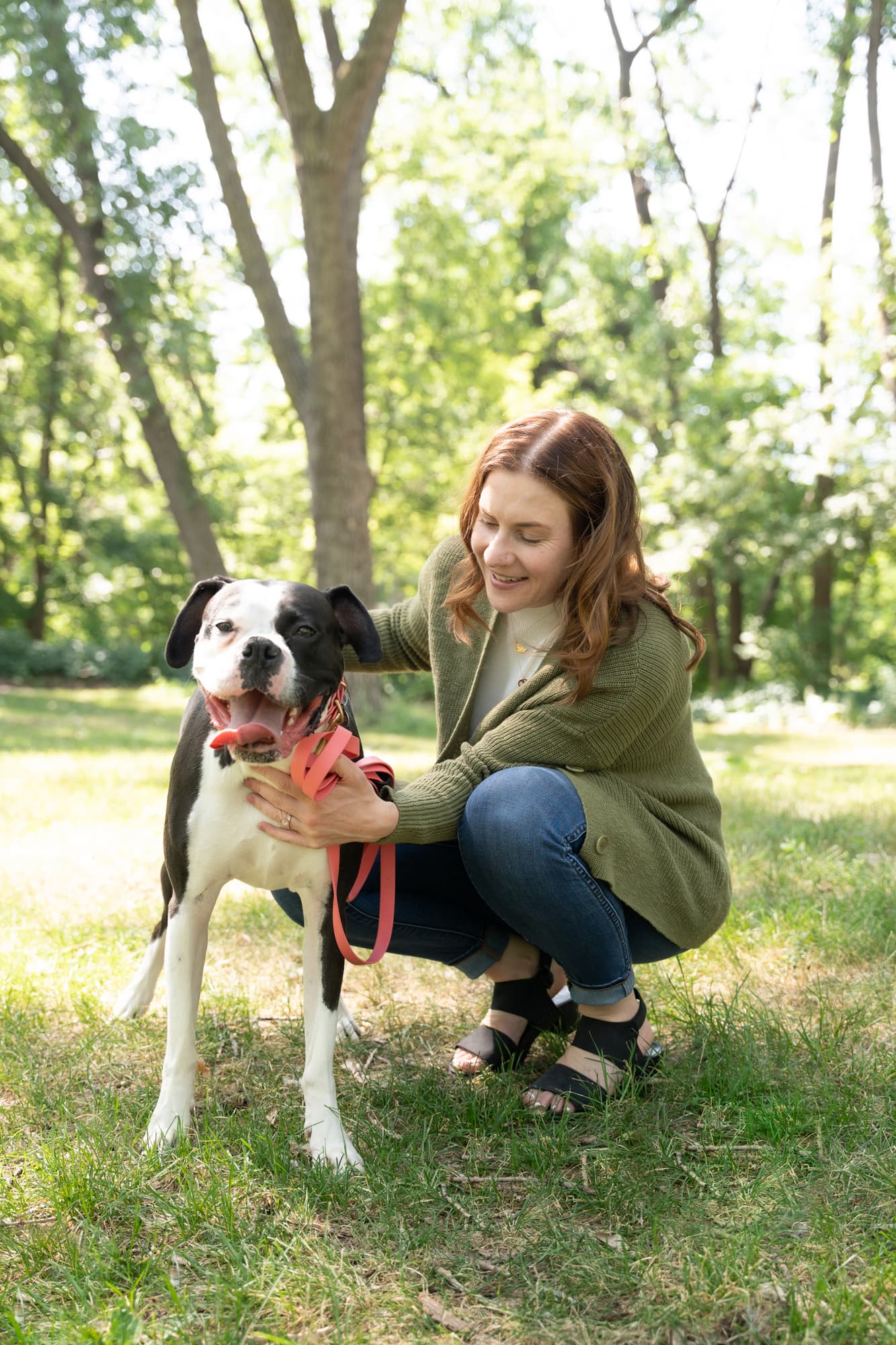 MacKenzie petting Dottie on a walk outside